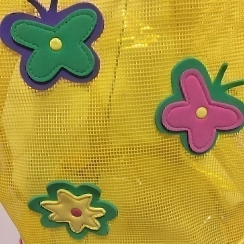 Girl’s yellow beach bag